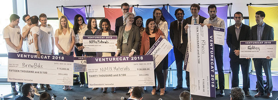 Panoramic photograph of winning teams at VentureCat 2018. 