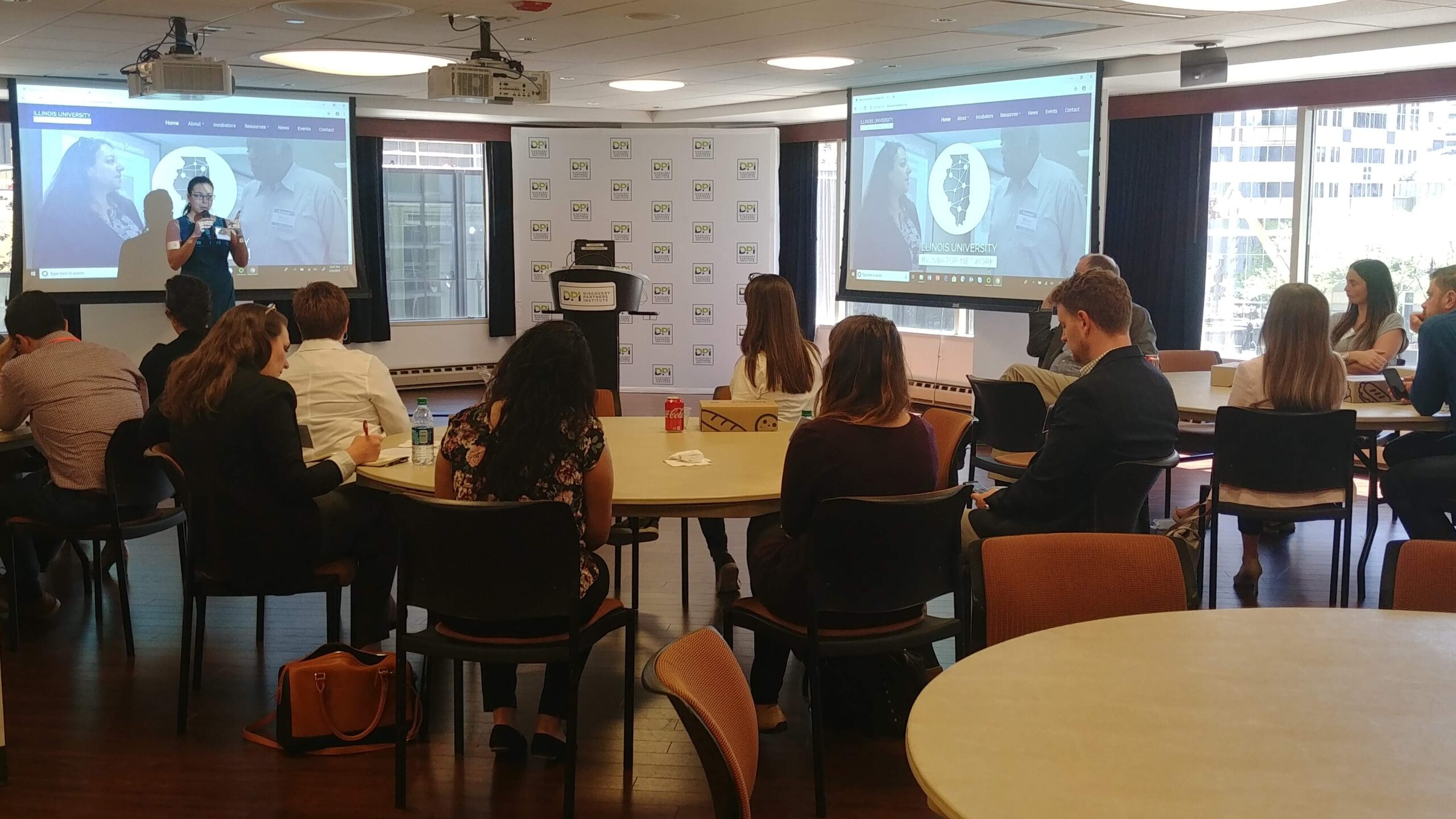 Photo of Illinois University Incubator Network peers at the 2019 IUIN Annual Meeting and engaged in a presentation by IL DCEO leadership in the Office of Entrepreneurship, Innovation, and Technology.